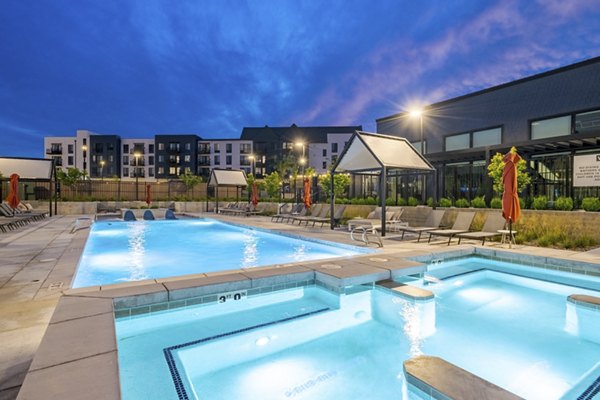 Luxurious outdoor pool with loungers at Novel Daybreak Apartments, a premier Greystar community