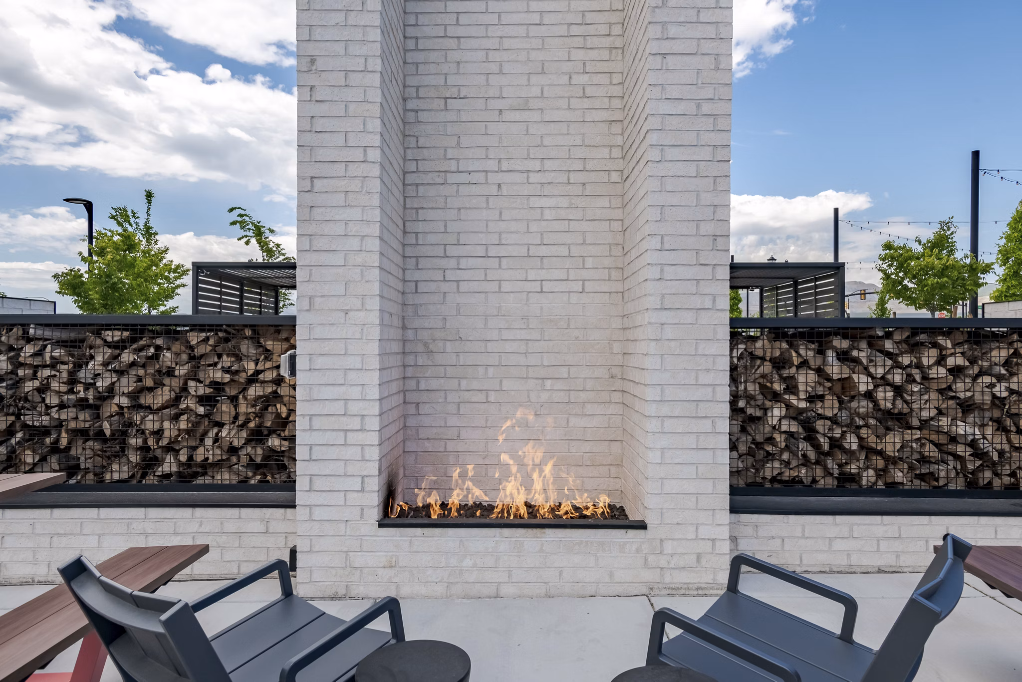 Cozy outdoor fire pit area at Novel Daybreak Apartments for relaxing evenings