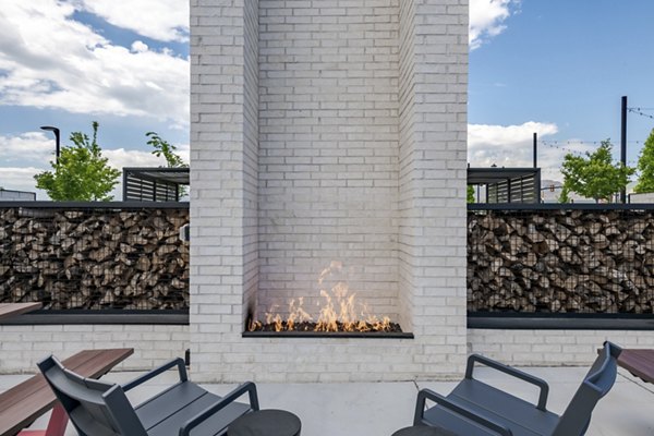 Cozy outdoor fire pit area at Novel Daybreak Apartments for relaxing evenings