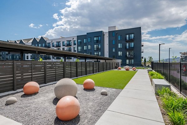 Courtyard with outdoor seating at Novel Daybreak Apartments, a luxury Greystar property