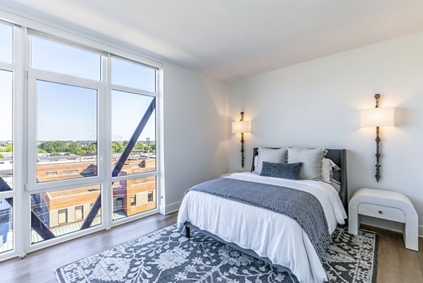 Cozy bedroom with modern decor at Otis Apartments
