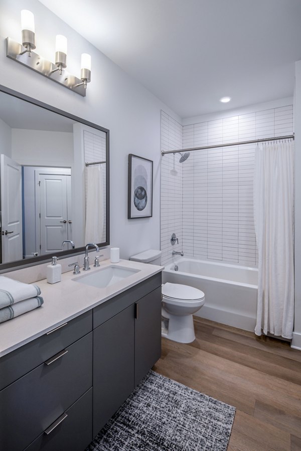 Modern bathroom featuring sleek fixtures at Otis Apartments