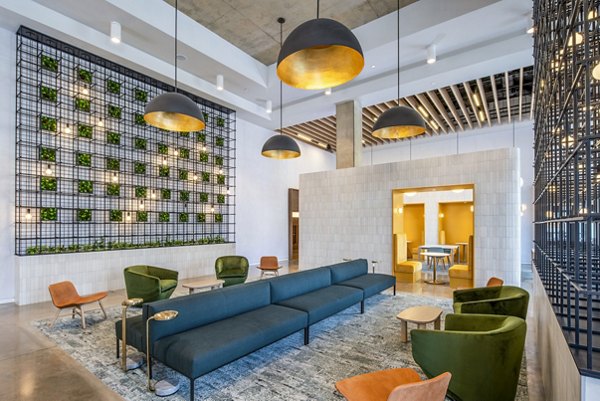 Clubhouse featuring modern design and comfortable seating at Otis Apartments, a luxury property by Greystar