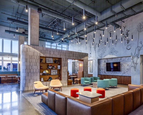 Modern clubhouse featuring comfortable seating and social spaces at Otis Apartments, luxurious living by Greystar