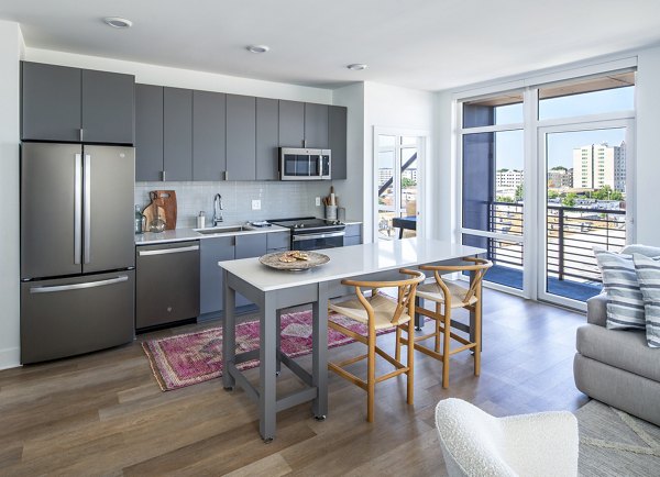Dining room with elegant decor and modern furniture at Otis Apartments