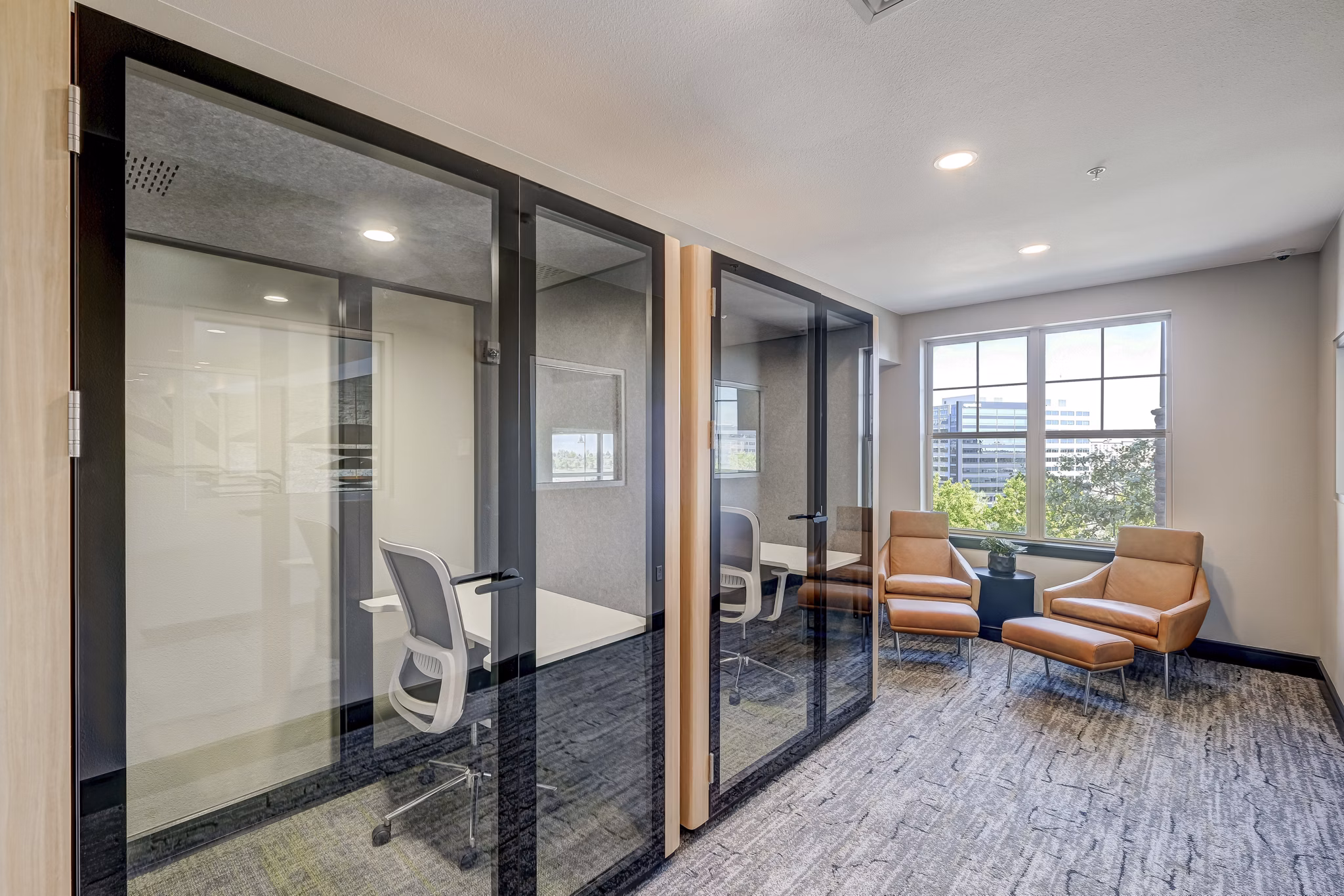 Clubhouse business center with modern workstations at Heights at Interlocken Apartments, ideal for luxury living and productivity