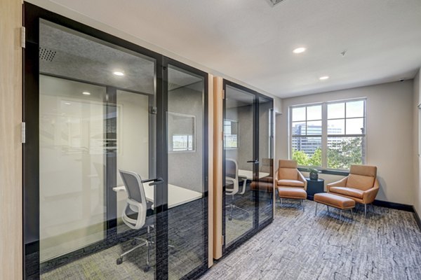 Clubhouse business center with modern workstations at Heights at Interlocken Apartments, ideal for luxury living and productivity