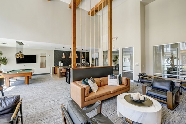 Modern clubhouse with cozy seating and vibrant decor at Heights at Interlocken Apartments