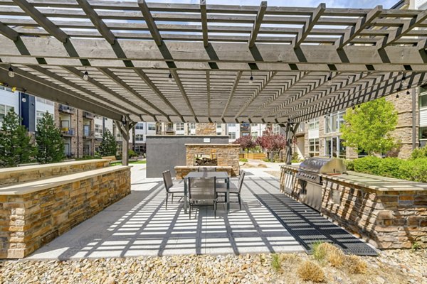 Grill and fire pit patio at Heights at Interlocken Apartments offering luxurious outdoor seating and modern design for relaxing gatherings