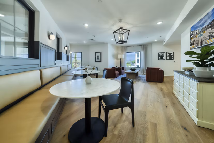 Modern clubhouse featuring cozy seating and open spaces at The Riley Apartments