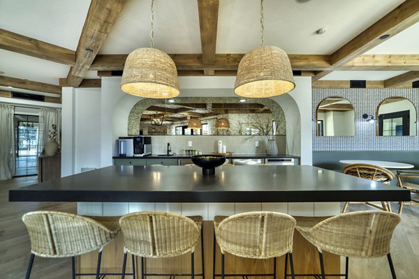 Clubhouse featuring modern furnishings and open floor plan at The Riley Apartments