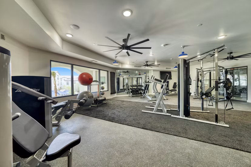 Modern fitness center with state-of-the-art equipment at The Riley Apartments