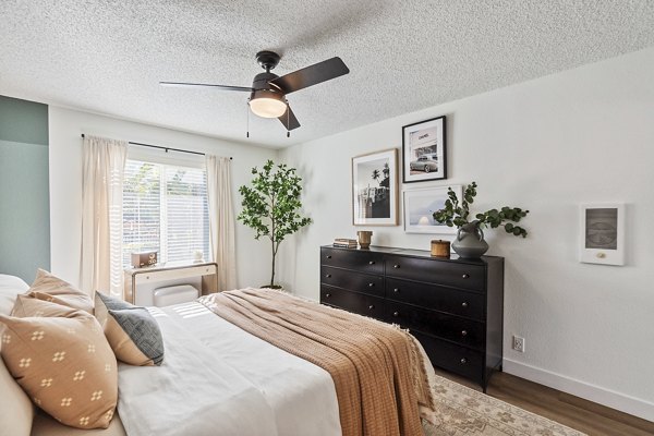 Bedroom featuring modern design and plush bedding at Madera Ridge Apartments