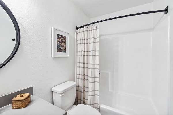 Bathroom featuring modern fixtures and marble countertops at Madera Ridge Apartments, a premier Greystar luxury apartment community