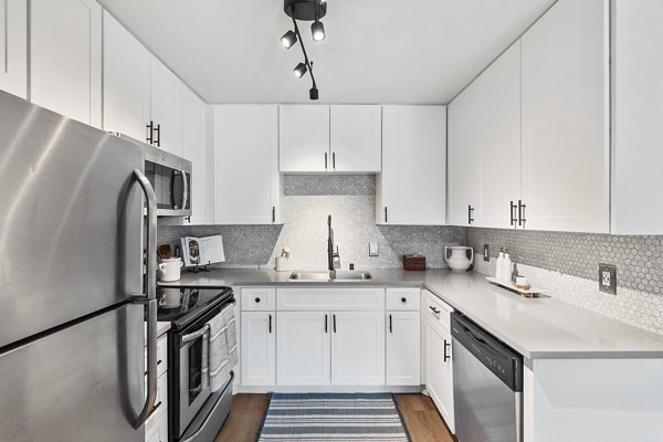 Modern kitchen with stainless steel appliances at Madera Ridge Apartments