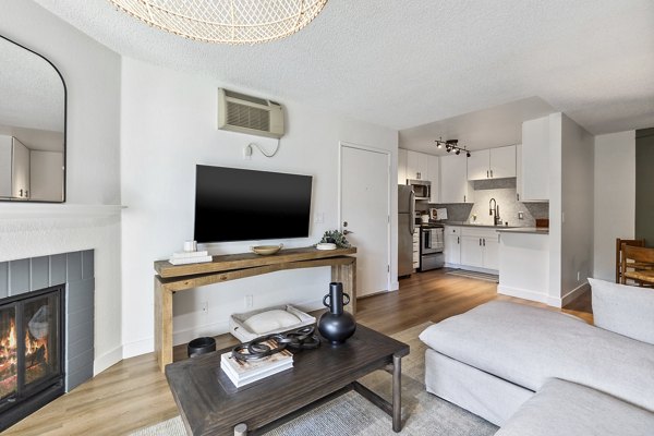 Modern living room with elegant furnishings in Madera Ridge Apartments, offering luxury lifestyle options in a serene setting