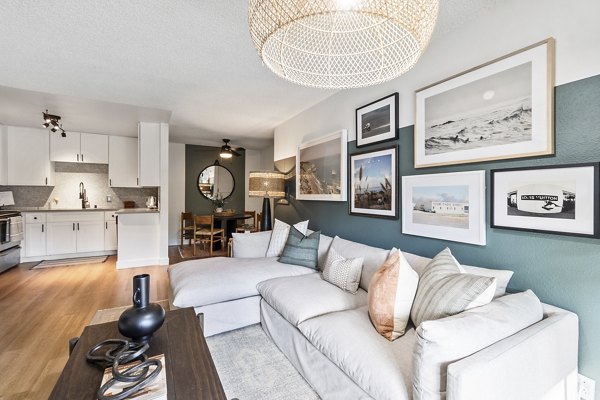 Living room with sleek furniture and natural light at Madera Ridge Apartments