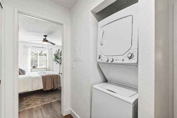 Laundry room with state-of-the-art appliances at Madera Ridge Apartments