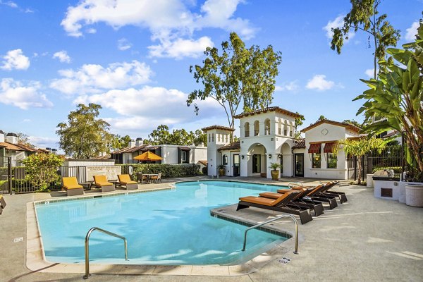 Pool with surrounding lounge chairs at Madera Ridge Apartments, a luxury Greystar property