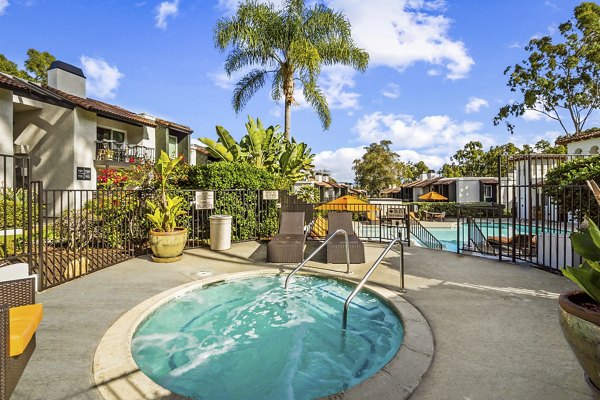 Relaxing hot tub at Madera Ridge Apartments with scenic views, offering luxury amenities for residents