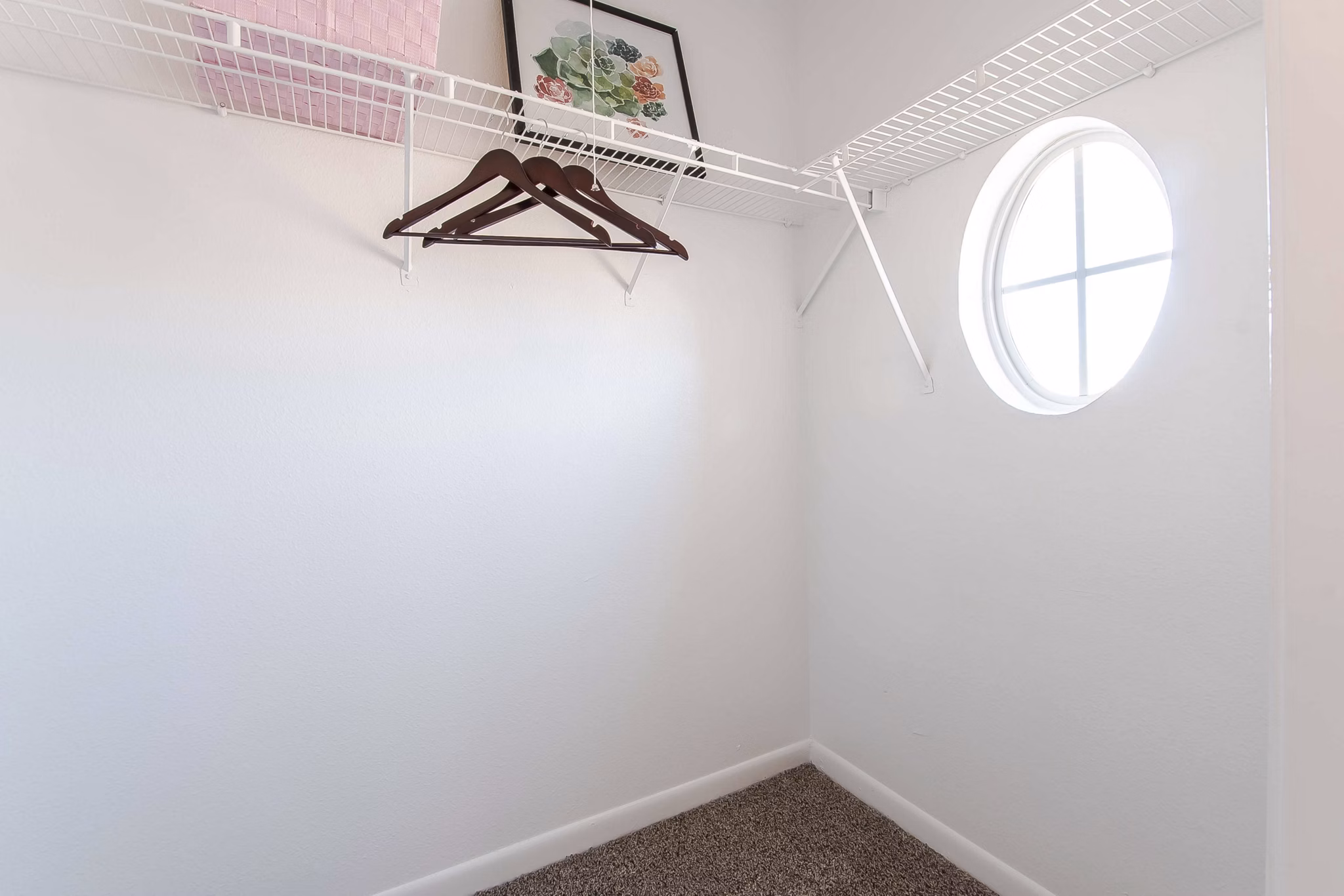 Spacious closet featuring built-in shelving in Parcside Townhomes Apartments