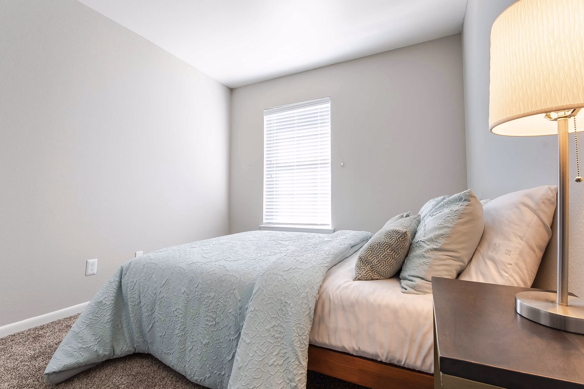 Comfortable bedroom with stylish decor at Parcside Townhomes Apartments in luxury community