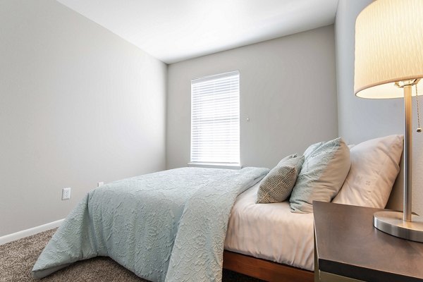 Comfortable bedroom with stylish decor at Parcside Townhomes Apartments in luxury community