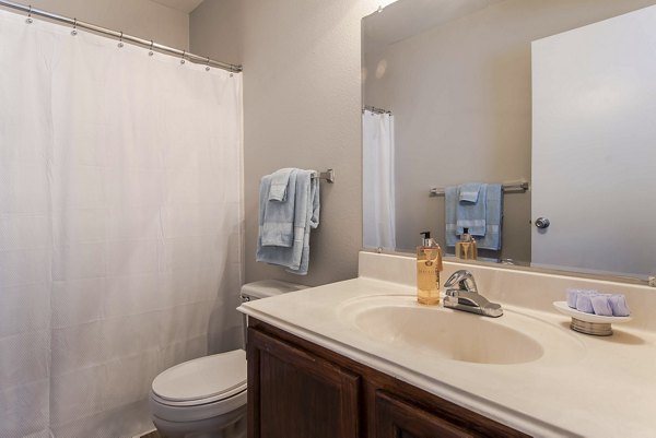 Modern bathroom with sleek fixtures at Parcside Townhomes Apartments