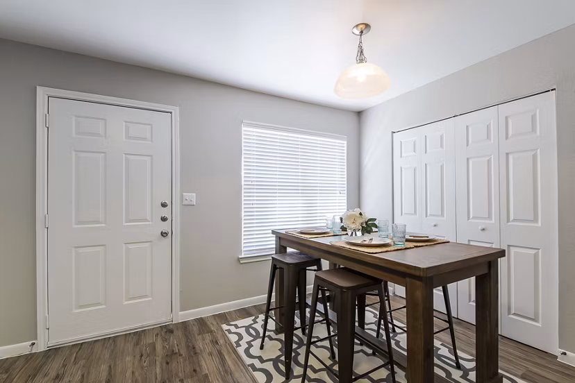 Dining area with modern furnishings at Parcside Townhomes Apartments, offering luxury living in a comfortable setting