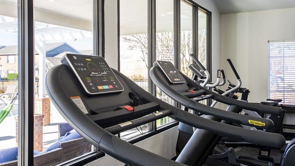 Modern fitness center featuring state-of-the-art equipment at Parcside Townhomes Apartments