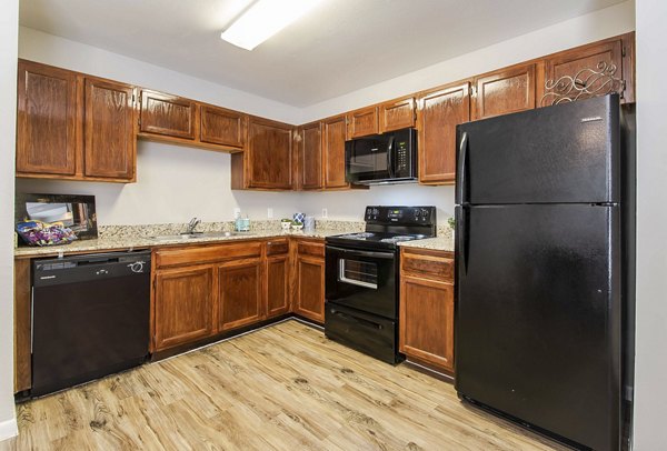 Modern kitchen with stainless steel appliances at Parcside Townhomes Apartments