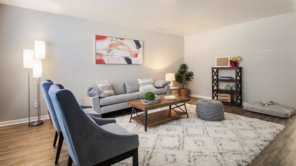 Living room with modern decor and cozy seating at Parcside Townhomes Apartments, offering luxury living in a vibrant community