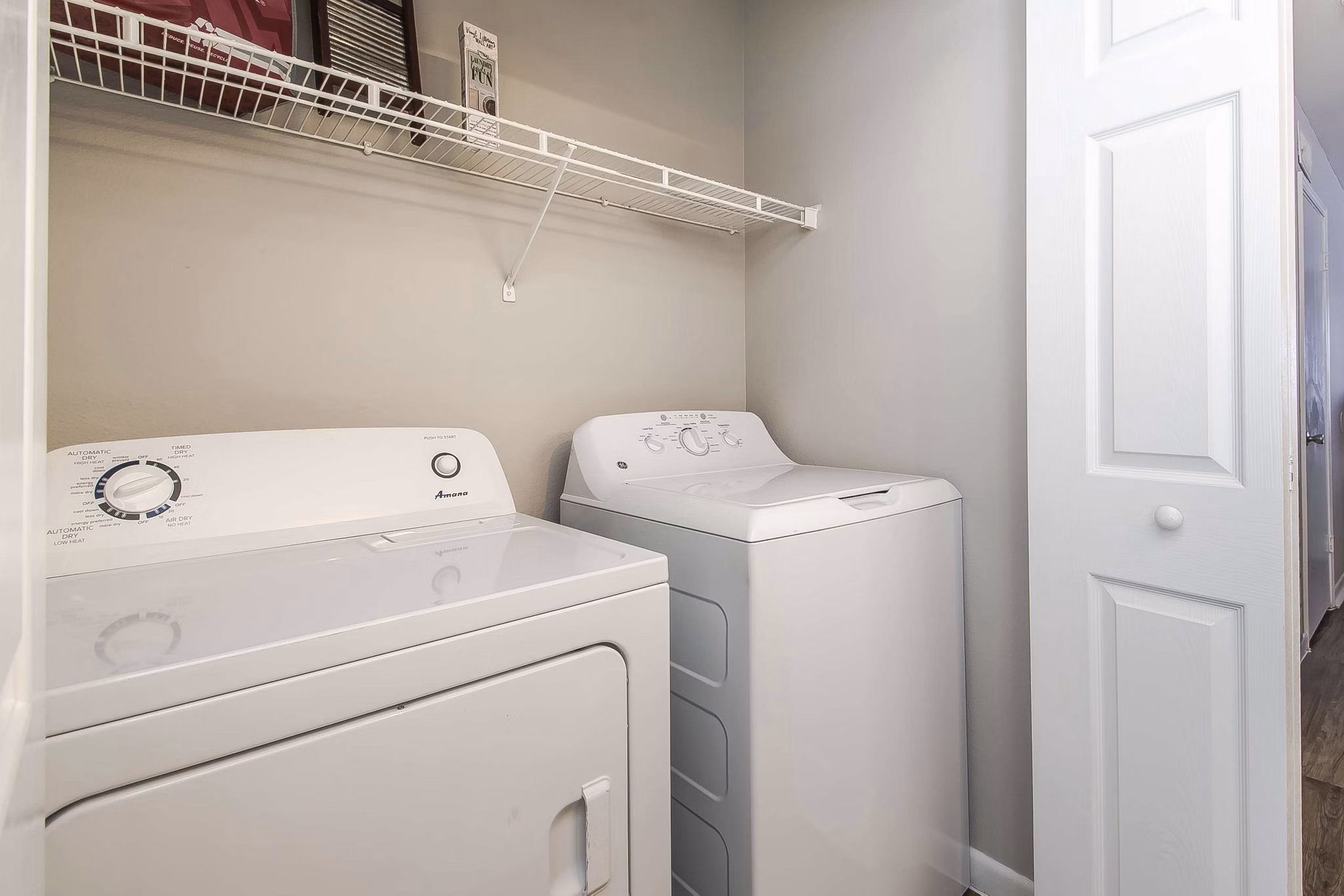 Laundry room with modern appliances in Parcside Townhomes Apartments, offering convenient in-unit laundry facilities