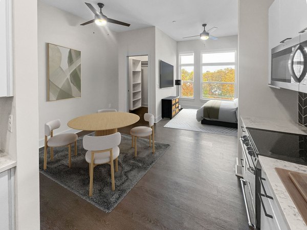 Dining area featuring modern design and elegant furnishings at The Winston Apartments