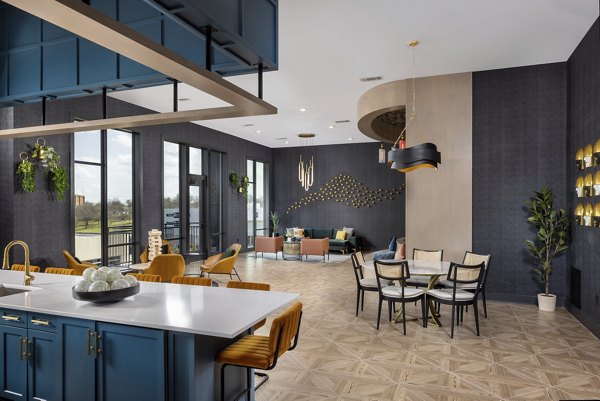 Clubhouse with modern decor and ample seating at Broadstone Centennial Apartments, offering a luxurious communal space for residents