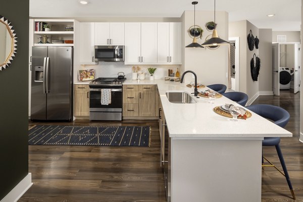 Modern kitchen with stainless steel appliances at Broadstone Centennial Apartments, offering luxury living and convenience in every detail