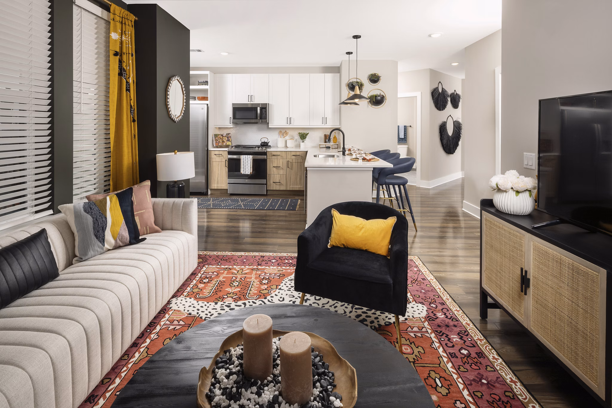 Elegant living room with modern furnishings and abundant natural light at Broadstone Centennial Apartments