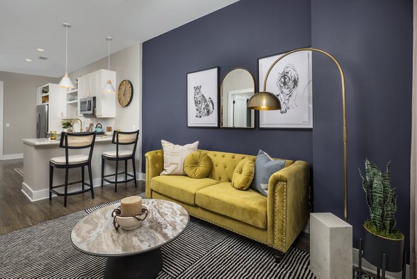 Modern living room with stylish decor and natural light at Broadstone Centennial Apartments