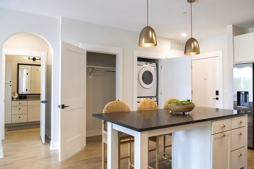 Modern kitchen with stainless steel appliances in Novel University Place Apartments
