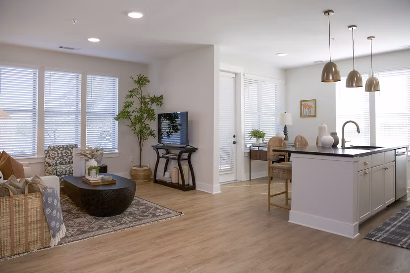 Spacious kitchen with sleek countertops and modern appliances in Novel University Place Apartments