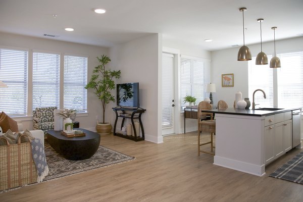 Spacious kitchen with sleek countertops and modern appliances in Novel University Place Apartments