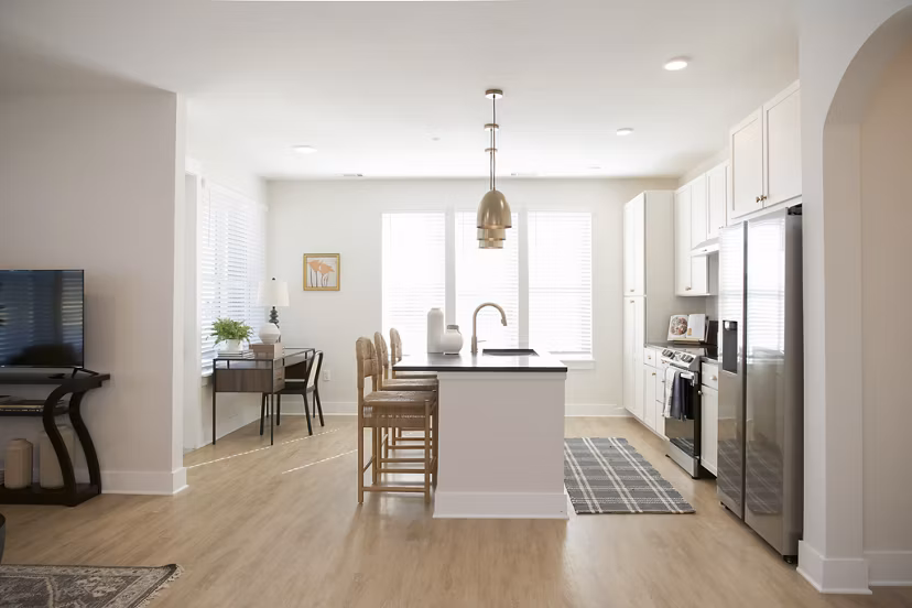Modern kitchen with stainless steel appliances at Novel University Place luxury apartments