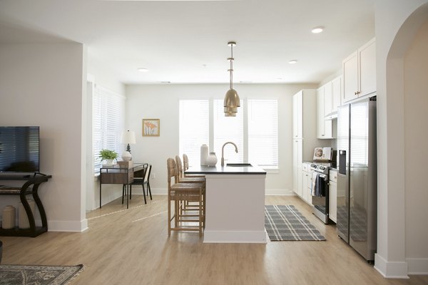 Modern kitchen with stainless steel appliances at Novel University Place luxury apartments
