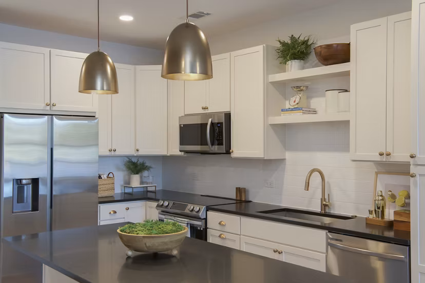 Modern kitchen with sleek countertops and stainless steel appliances at Novel University Place Apartments