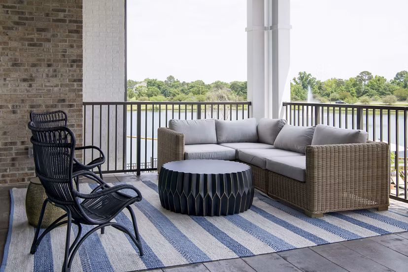 Spacious patio with modern outdoor furniture at Novel University Place Apartments, perfect for relaxation and gatherings