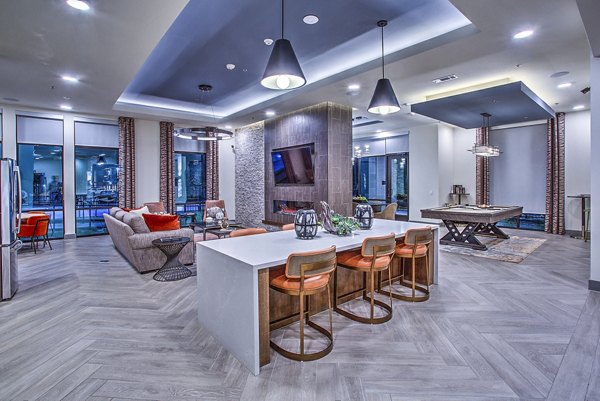 McKinney Terrace Apartments: Elegant clubhouse with modern decor and seating areas, ideal for social gatherings and events