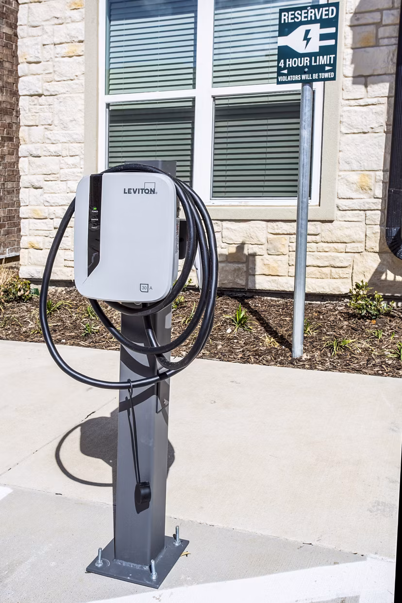 EV car charging station at McKinney Terrace Apartments offering convenient green living options for residents