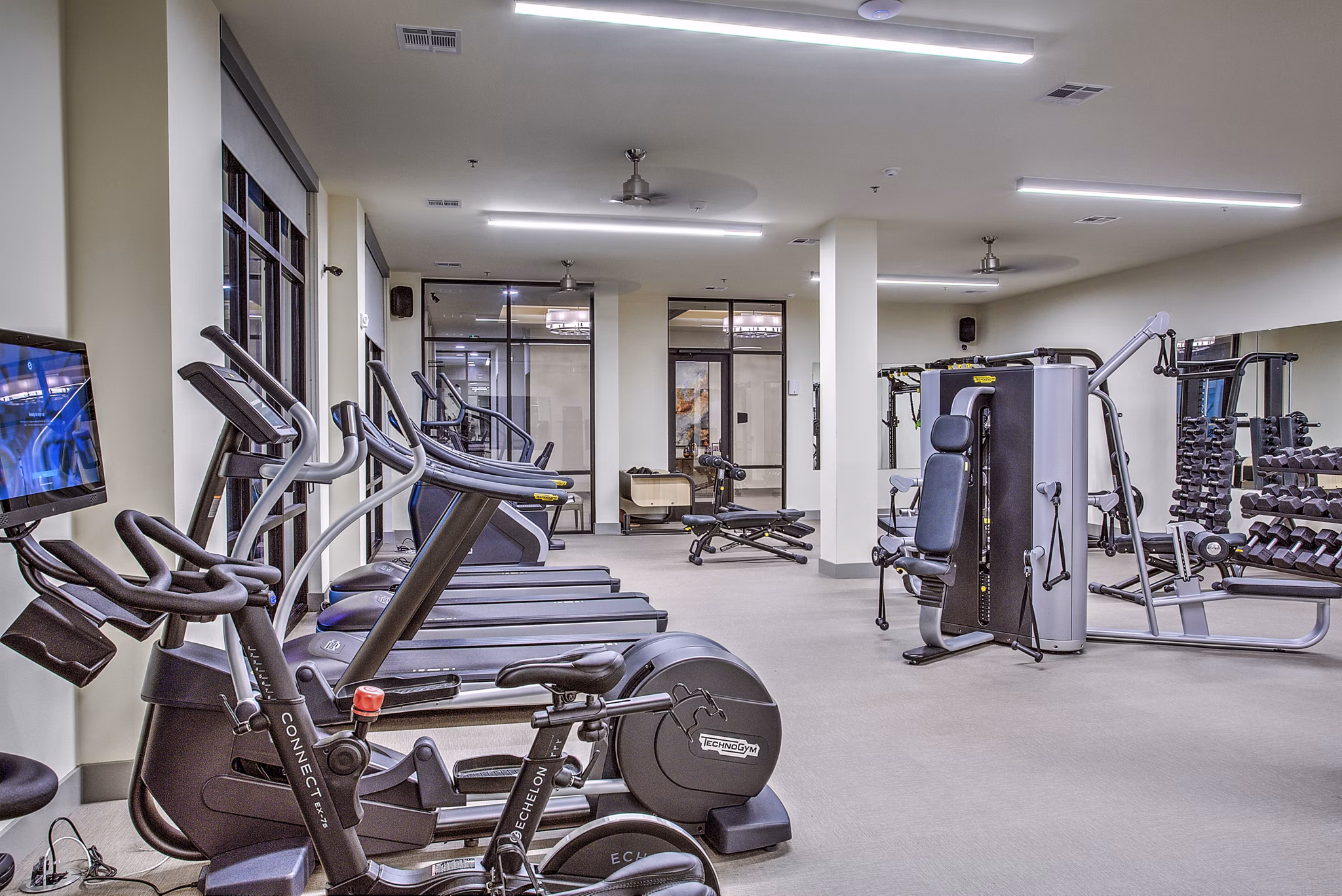 State-of-the-art fitness center with modern equipment at McKinney Terrace Apartments