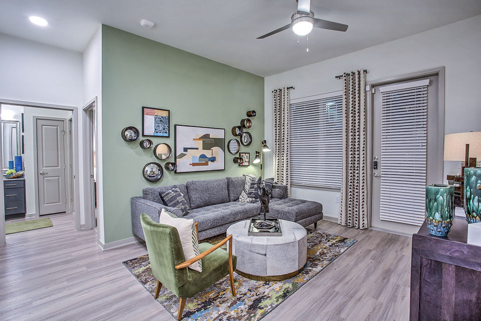 Spacious living room with modern furniture at McKinney Terrace Apartments