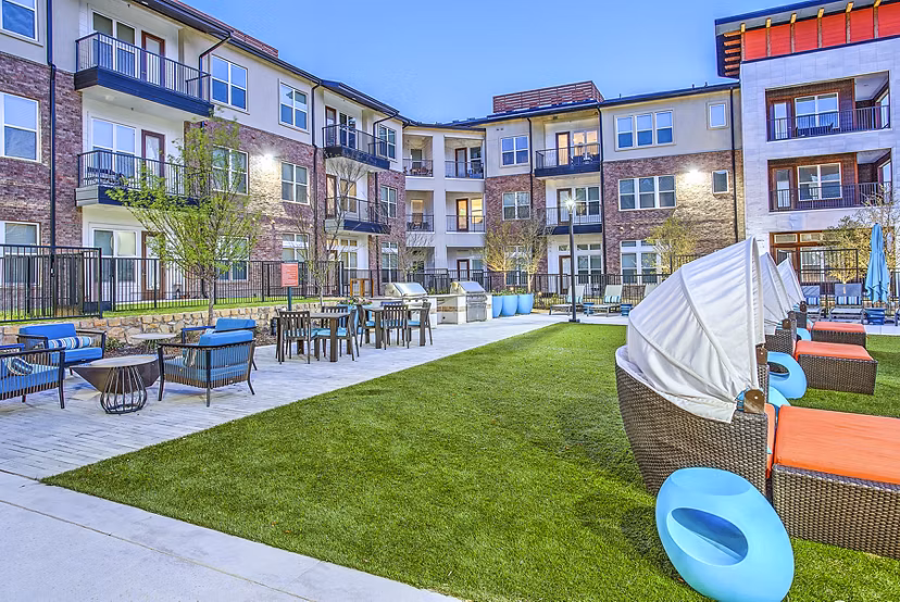 Outdoor grill area and patio at McKinney Terrace Apartments, ideal for community gatherings and relaxation
